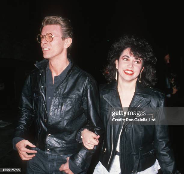 Musician David Bowie and date Melissa Hurley attend the performance of Hurlyburly on December 2, 1988 at the Westwood Theater in Westwood, California.