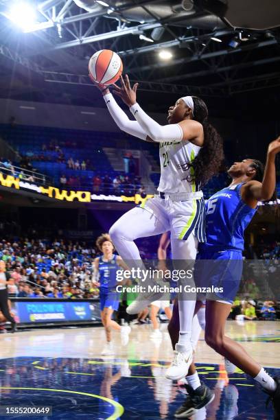 Arike Ogunbowale of the Dallas Wings drives to the basket during the game against the Connecticut Sun on July 25, 2023 at the College Park Center in...