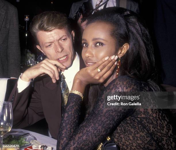 Musician David Bowie and model Iman attend Seventh on Sale AIDS Benefit on November 29, 1990 at the Armory in New York City.