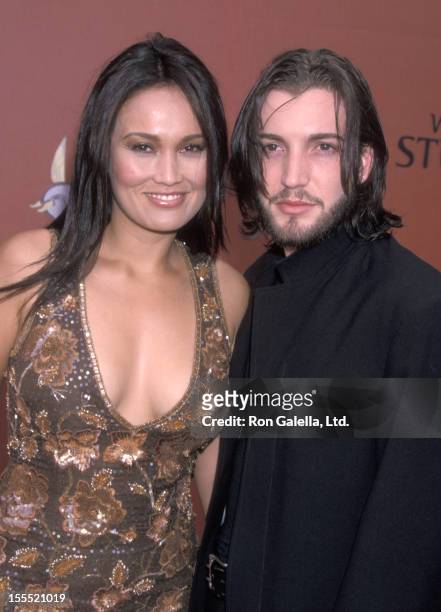 Actress Tia Carrere and Simon Wakelin attend the First Annual World Stunt Awards on May 20, 2001 at The Barker Hangar at the Santa Monica Air Center...