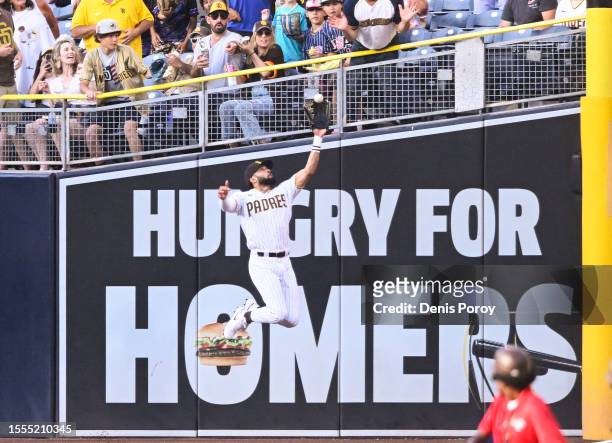 Fernando Tatis Jr. #23 of the San Diego Padres makes a leaping catch on a ball hit by Bryan Reynolds of the Pittsburgh Pirates during the first...