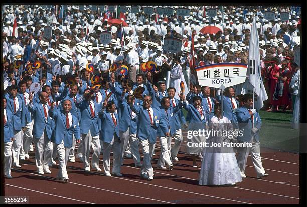 THE OLYMPIC SQUAD OF KOREA MARCH THROUGH THE STADIUM DURING THE OPENING CEREMONY OF THE 1988 SUMMER OLYMPICS HELD IN SEOUL IN SOUTH KOREA.