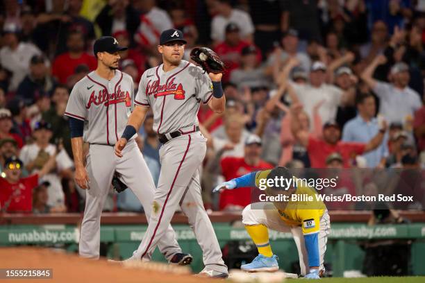 Austin Riley of the Atlanta Braves reacts after tagging out Masataka Yoshida as he attempts to advance to third base to record the third out of a...