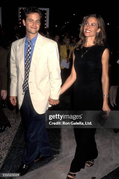 Actor Kirk Cameron and actress Chelsea Noble arrive at A Concert of Hope Benefit on October 16, 1995 at the Pantages Theater in Hollywood, California.