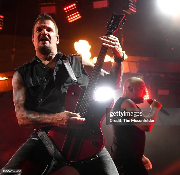 Dan Donegan and David Draiman of Disturbed perform in support of the band's "Divisive" release at Toyota Amphitheatre on July 18, 2023 in Wheatland,...