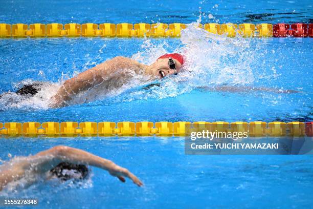 Britain's Duncan Scott competes in a heat of the men's 200m individual medley swimming event during the World Aquatics Championships in Fukuoka on...