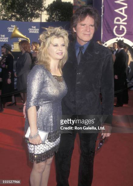 Musician John Fogerty and wife Julie Lebiedzinski attend the 41st Annual Grammy Awards on February 24, 1999 at Shrine Auditorium in Los Angeles,...