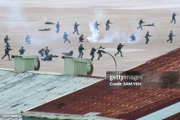 Taiwanese soldiers take part in the military Han Guang drill at the Taoyuan International Airport on July 26, 2023.