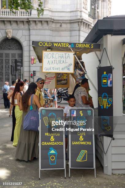 News stand selling cold water and refreshments at the iconic Plaza de Cibeles on a very hot afternoon on July 18, 2023 in Madrid, Spain. An area of...