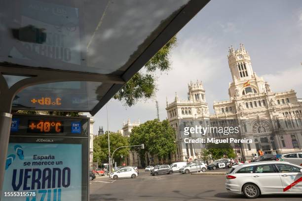 Digital thermometer reads 40 degrees Celsius at a bus-stop at the iconic Plaza de Cibeles on July 18, 2023 in Madrid, Spain. An area of high...