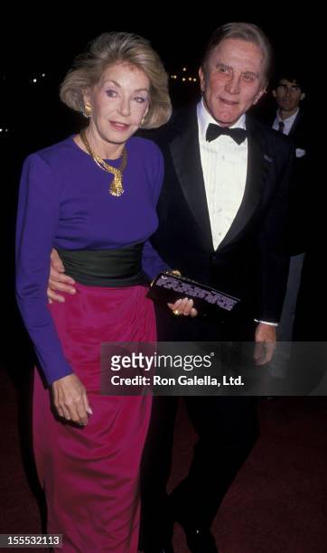 Actor Kirk Douglas and wife Anne Douglas attend the premiere of Scrooged on November 17, 1988 at Mann Chinese Theater in Hollywood, California.
