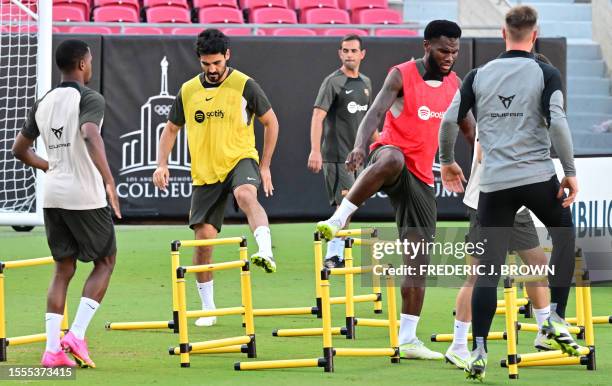 Barcelona new signing Ilkay Gundogan and Franck Kessie go through their drills during a training session at the Los Angeles Coliseum in Los Angeles,...