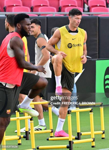 Barcelona's Robert Lewandowski and Franck Kessie go through their drills during a training session at the Los Angeles Coliseum in Los Angeles,...