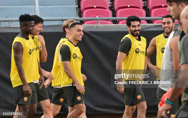 Barcelona new signing Ilkay Gundogan and teammates attend a training session at the Coliseum in Los Angeles, California on July 25 one day before...