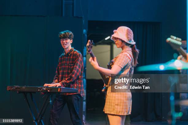 young asian multiracial group live band performance on stage - jam session stock pictures, royalty-free photos & images