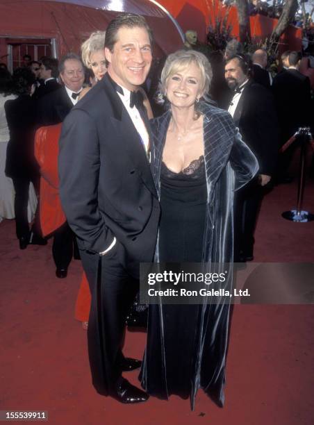 Actor Simon MacCorkindale and actress Susan George attend the 71st Annual Academy Awards on March 21, 1999 at Dorothy Chandler Pavilion in Los...