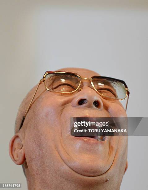 Tibet's spiritual leader Dalai Lama gestures as he answers questions during a press conference in Yokohama, suburban Tokyo, on November 5, 2012. The...