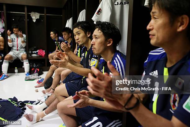 Japan players celebrate their 5-5 draw against Portugal in the dressing room during the FIFA Futsal World Cup, Group C match between Portugal and...