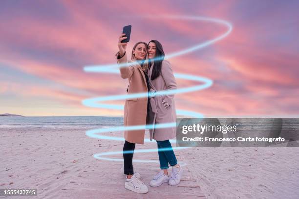 two  women taking selfie - smartphone hologram stock pictures, royalty-free photos & images
