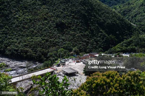 General view of the El Naranjal toll booth area seen with land debris after a landslide caused by heavy rains left at least 14 people dead and about...