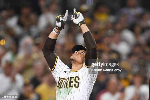 Juan Soto of the San Diego Padres points skyward after hitting a solo home run during the seventh inning of a baseball game against the Pittsburgh...