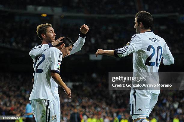 Angel Di Maria of Real Madrid CF celebrates scoring their second goal with teammates Sergio Ramos and Gonzalo Higuain during the La Liga match...