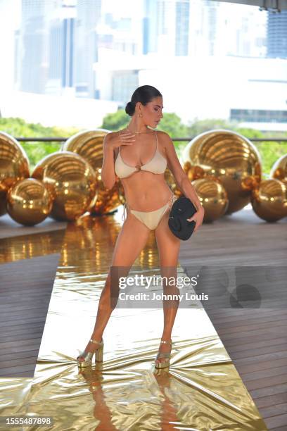 Models walk the runway for Sundaze Swim during Flying Solo Miami Swim & Resort Show at Pérez Art Museum on July 12, 2023 in Miami, Florida.