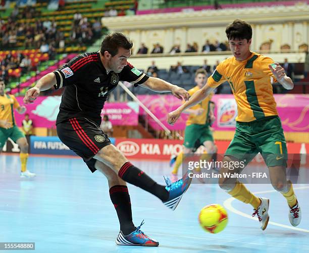 Omar Cervantes of Mexico looks to shoot past Tobias Seeto of Australia during the FIFA Futsal World Cup Thailand 2012, Group D match between...