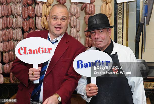 Al Murray and Michal Gigg attend a photocall to launch British Sausage Week at Allen's of Mayfair, London's oldest butcher shop on November 5, 2012...