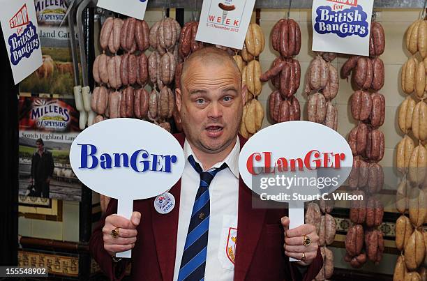 Al Murray attends a photocall to launch British Sausage Week at Allen's of Mayfair, London's oldest butcher shop on November 5, 2012 in London,...