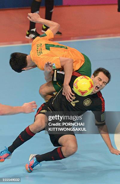 Omar Cervantes of Mexico battles for the ball with Tobias Seeto of Australia during their first round football match of the FIFA Futsal World Cup...