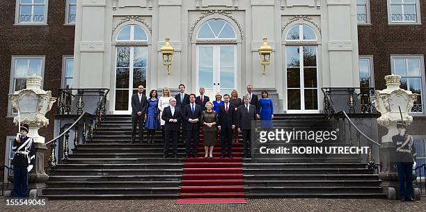 The new Dutch cabinet pose on the steps of the official residence of the Royal Family, Huis ten Bosch with Minister of Living and State Service Stef...