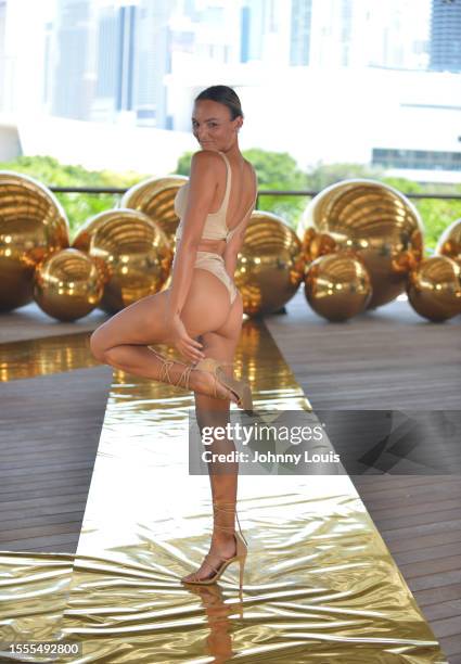 Models walk the runway for Or Swim Collection with Iza by Silvia D'Avila Jewelry during Flying Solo Miami Swim & Resort Show at Pérez Art Museum on...