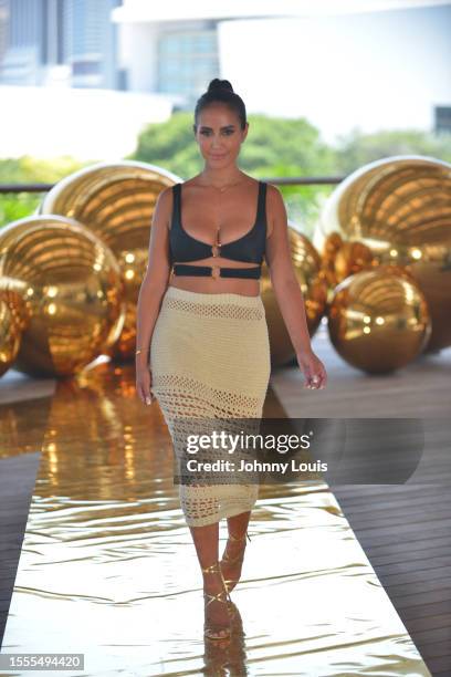 Models walk the runway for Or Swim Collection with Iza by Silvia D'Avila Jewelry during Flying Solo Miami Swim & Resort Show at Pérez Art Museum on...