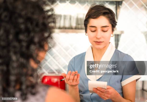 waitress taking customer's order - overworked waitress stock pictures, royalty-free photos & images