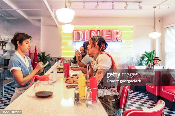 typical american diner - waitress booth stock pictures, royalty-free photos & images