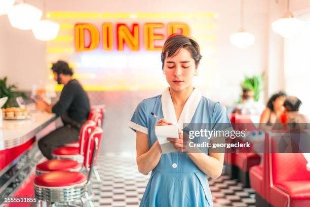 hardworking waitress taking another order - overworked waitress stock pictures, royalty-free photos & images