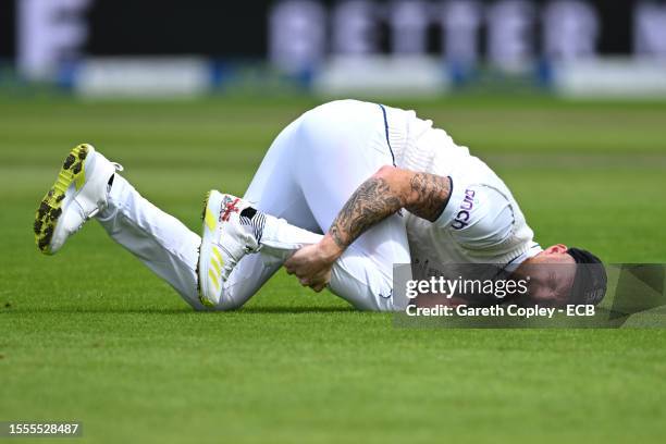 Ben Stokes of England clutches his shin after being hit by the ball during Day One of the LV= Insurance Ashes 4th Test Match between England and...