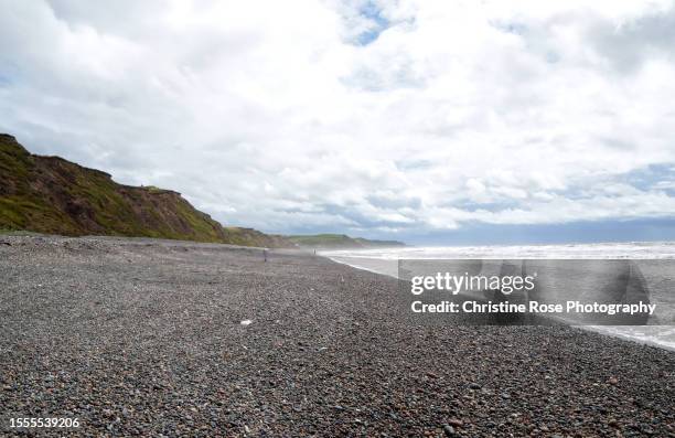 walking on the beach - st bees stock pictures, royalty-free photos & images