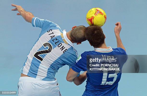 Gabriel Lima of Italy battles for the ball with Damian Stazzone of Argentina during their first round football match of the FIFA Futsal World Cup...
