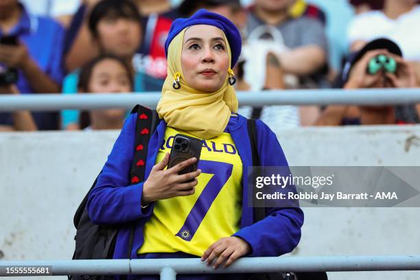 Female fan of Al-Nassr wearing a Cristiano Ronaldo of Al-Nassr Shirt during the pre-season friendly match between Paris Saint-Germain and Al-Nassr at...