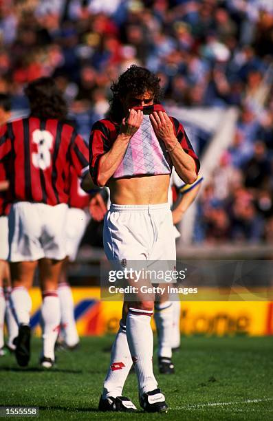 Marco Simone of AC Milan wipes his face with his shirt during a Serie A match against Parma AC at the Ennio Tardini Stadium in Parma, Italy. AC Milan...