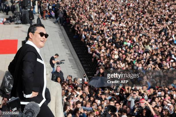 South Korean rapper Park Jae-Sang also known as Psy performs "Gangnam Style" in front of a crowd during a flashmob on November 5, 2012 in Paris. The...