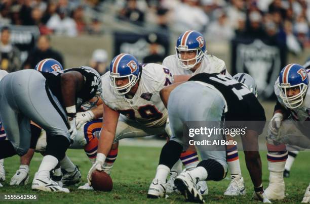 John Elway, Quarterback for the Denver Broncos calls the play on the line of scrimmage during the American Football Conference West Division game...