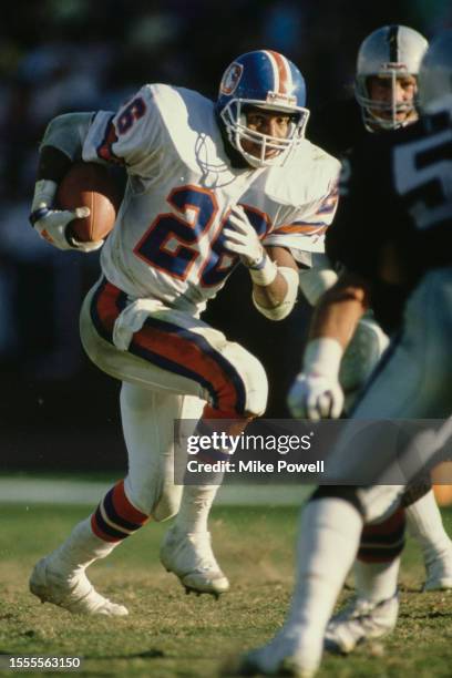 Bobby Humphrey, Running Back for the Denver Broncos in motion running the football during the American Football Conference West Division game against...