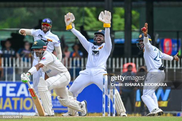 Sri Lanka's wicketkeeper Sadeera Samarawickrama , Dhananjaya de Silva and Nishan Madushka celebrate after the dismissal of Pakistan's Babar Azam...