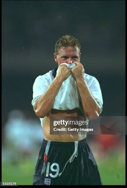 PAUL GASCOIGNE OF ENGLAND IS BROUGHT TO TEARS AFTER RECEIVING A YELLOW CARD IN THE WORLD CUP SEMI-FINAL MATCH AGAINST WEST GERMANY PLAYED AT THE...