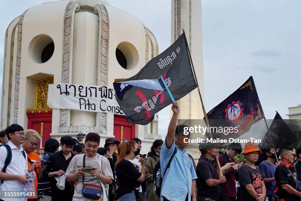 People gather during a rally organized by activist groups United Front of Thammasat and Demonstration and Thalugaz at the Democracy Monument on July...