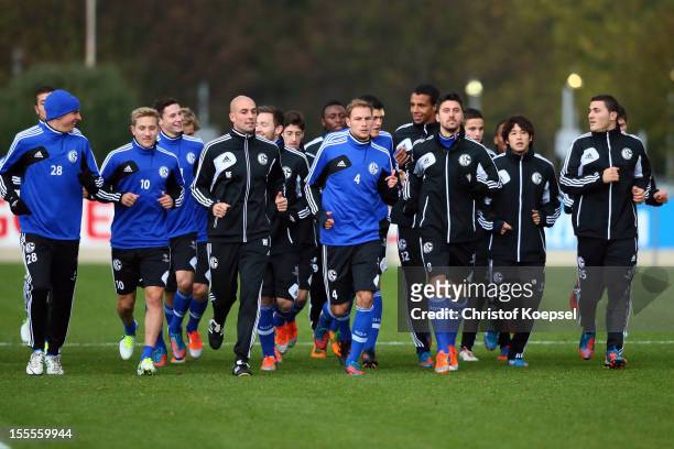 The team of FC Schalke 04 attends a training session at their training ground ahead of the UEFA Champions League group B match between FC Schalke 04...
