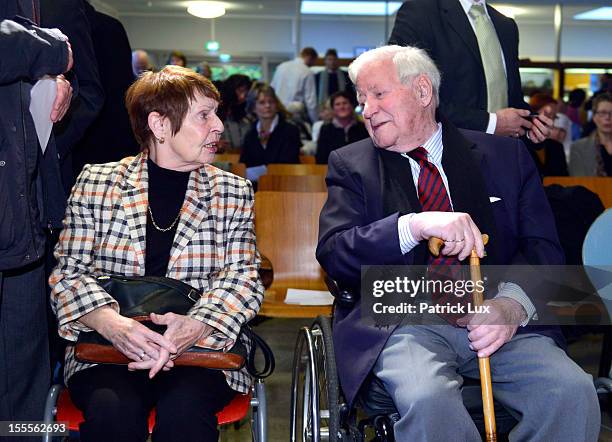 Former German Chancellor Helmut Schmidt and his partner Ruth Loah attend a ceremony at the Kirchdorf/Wilhelmsburg Gymnasium high school on the day...